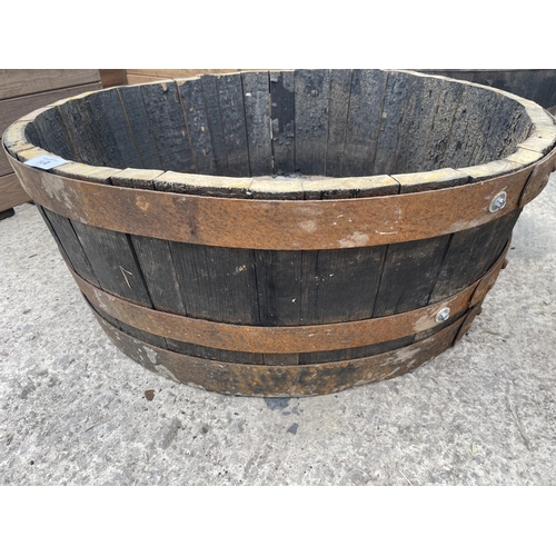 144 - TWO HALF BARREL PLANTERS NO VAT