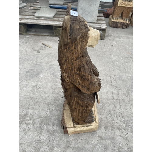 81 - A CARVED WOODEN ORNAMENT OF A WELCOME BEAR 60 CM HIGH NO VAT