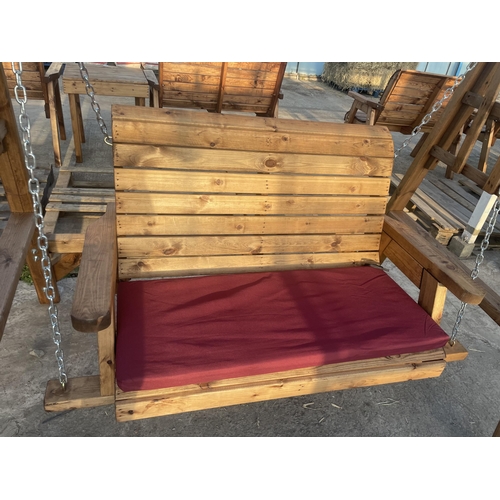 263 - AN AS, NEW EX DISPLAY CHARLES TAYLOR SWING SEAT WITH TRELLIS SIDES, SEAT COVER AND CANOPY + VAT