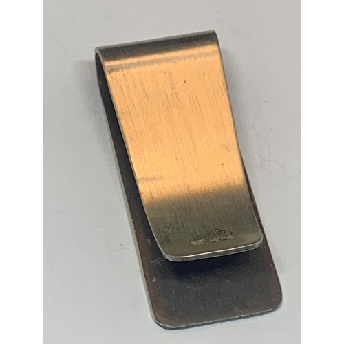 525 - A MARKED SILVER MONEY CLIP