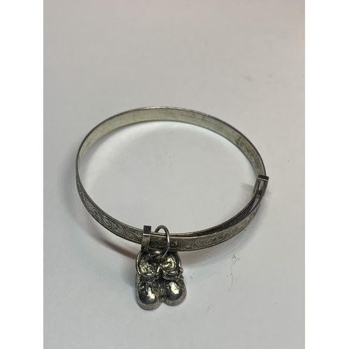 527 - TWO SILVER BANGLES TO INCLUDE A CHILDS WITH CHARMS