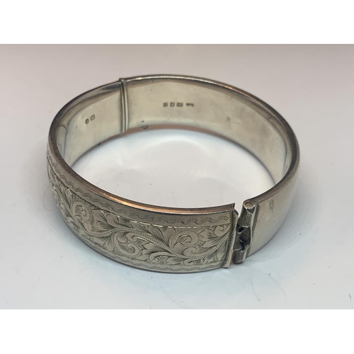 528 - A SILVER BANGLE