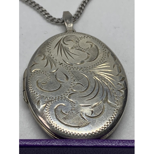 536 - A SILVER NECKLACE WITH HALLMARKED BIRMINGHAM SILVER LOCKET IN A PRESENTATION BOX