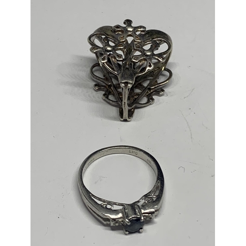 556 - FOUR VARIOUS SILVER RINGS