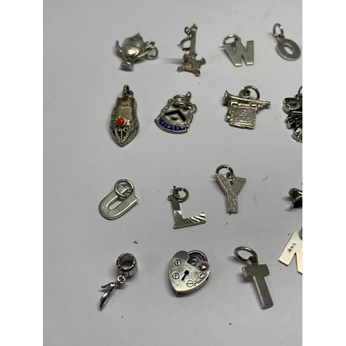 558 - TWENTY THREE VARIOUS SILVER CHARMS