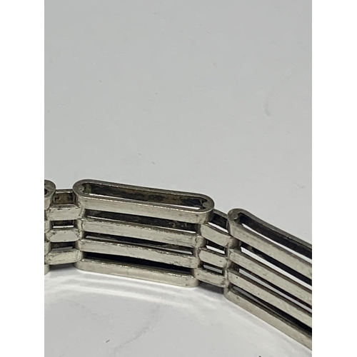 559 - A SILVER FOUR BAR GATE BRACELET