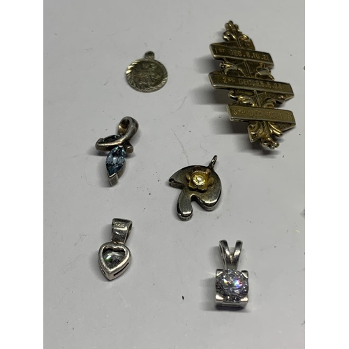 561 - ELEVEN VARIOUS SILVER CHARMS AND PENDANTS