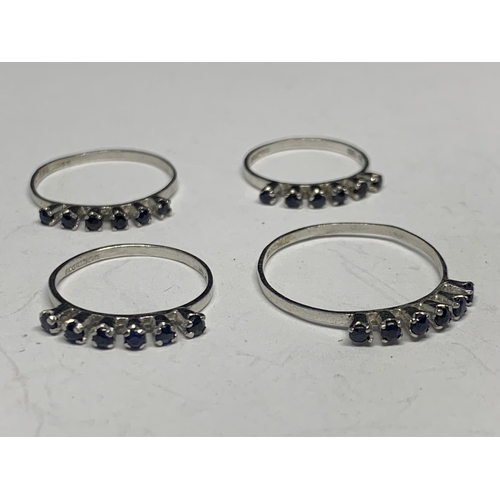 586 - FOUR SILVER RINGS WITH SAPPHIRES