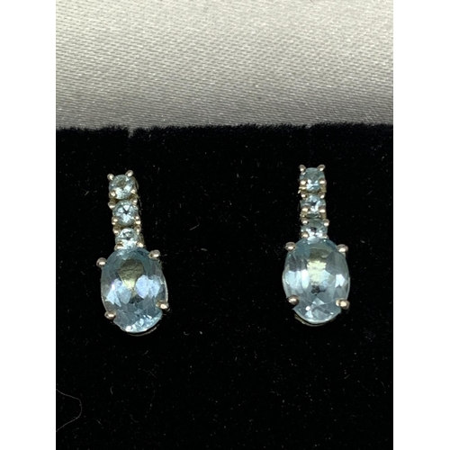 588 - A PAIR OF SILVER AND TOPAZ EARRINGS IN A PRESENTATION BOX