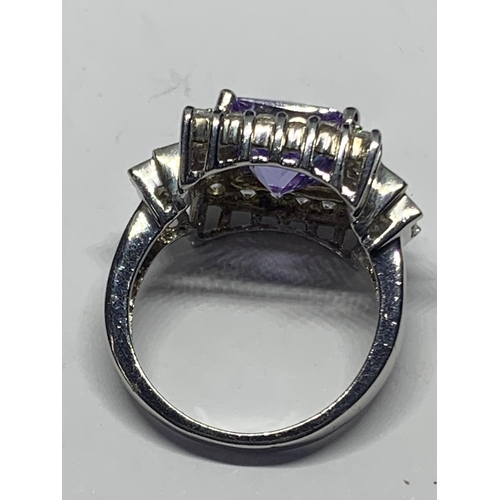 613 - A SILVER AND AMETHYST RING SIZE P IN A PRESENTATION BOX