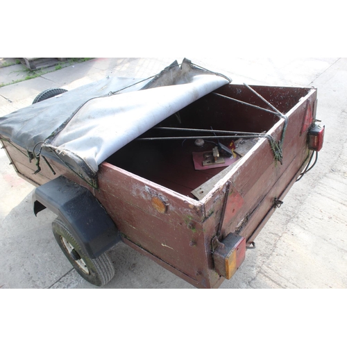 101 - A SMALL WOODEN TWO WHEEL TRAILER NO VAT