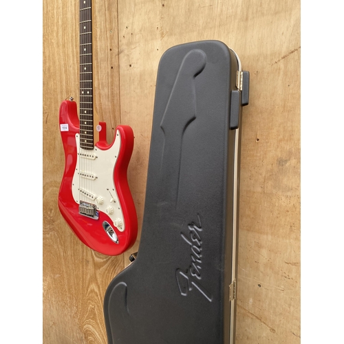 1514 - A RED FENDER STRATOCASTER ELECTRIC GUITAR WITH FENDER CARRY CASE CONTAINING ACCESSORIES (SERIAL NUMB... 