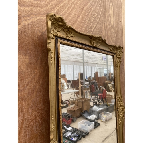 1518 - A RECTANGULAR DECORATIVE GILT FRAMED WALL MIRROR