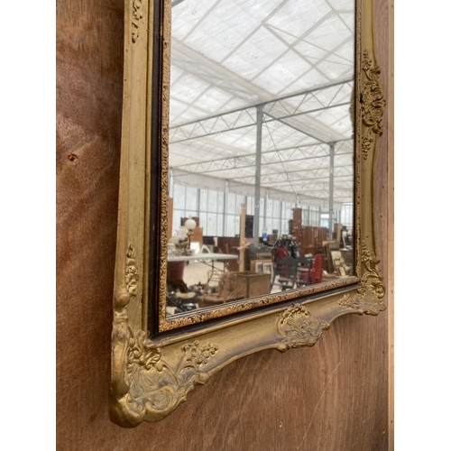 1518 - A RECTANGULAR DECORATIVE GILT FRAMED WALL MIRROR