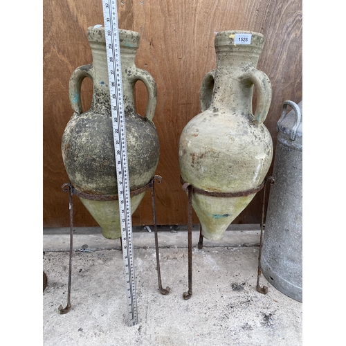 1528 - A PAIR OF METAL PLANT POT HOLDERS COMPLETE WITH TWO TERRACOTTTA URNS (H:79CM)