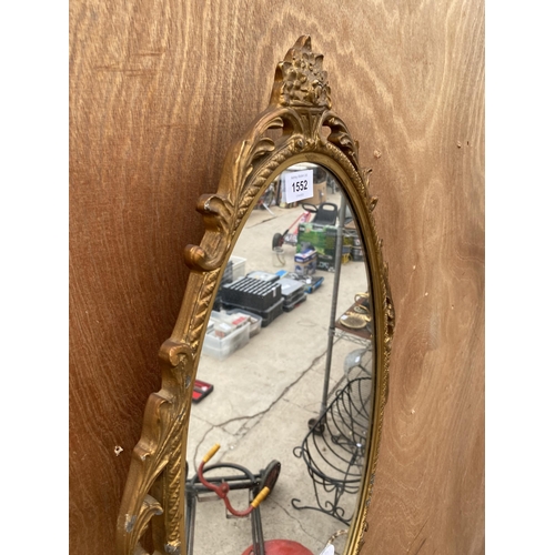 1552 - A DECORATRIVE GILT FRAMED WALL MIRROR