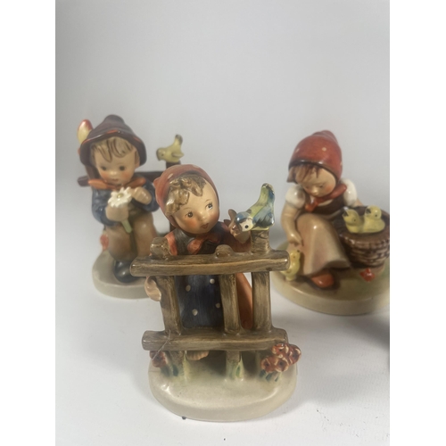 702 - A GROUP OF FIVE VINTAGE GOEBEL HUMMEL FIGURES TO INCLUDE CHOIR BOY ETC