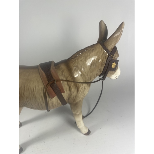 718 - A SYLVAC DONKEY FIGURE WITH LEATHER REIGNS