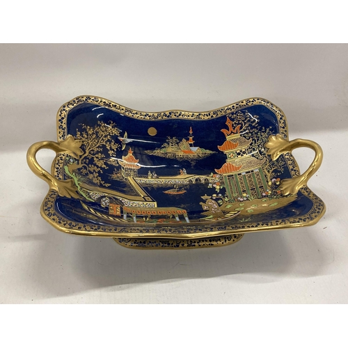 35 - A CARLTON WARE TWIN HANDLED PEDESTAL BOWL DECORATED IN THE 'MIKADO' PATTERN WITH GILT DESIGN ON A CO... 