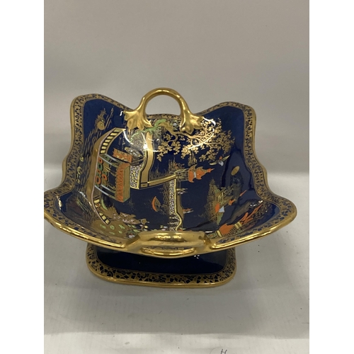 35 - A CARLTON WARE TWIN HANDLED PEDESTAL BOWL DECORATED IN THE 'MIKADO' PATTERN WITH GILT DESIGN ON A CO... 