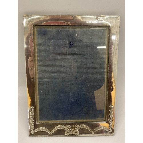 39 - A HALLMARKED SILVER RECTANGULAR PHOTO FRAME WITH FLORAL SWAG DESIGN (HALLMARKS RUBBED)