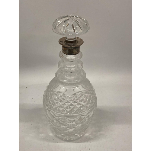 47 - A CUT GLASS MALLET DECANTER WITH LONDON HALLMARKED SILVER COLLAR