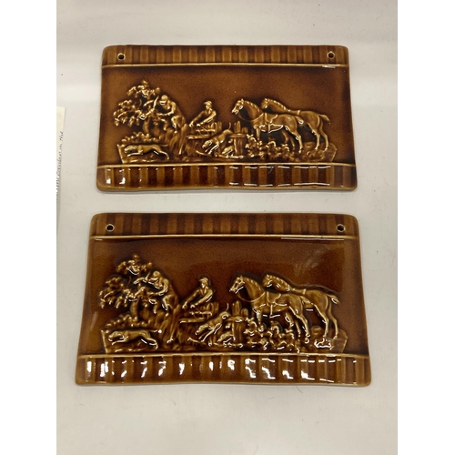 7 - A PAIR OF LATE 19TH CENTURY TREACLE GLAZE EARTHENWARE PLAQUES WITH FOX AND HOUNDS HUNTING DESIGN, 26... 