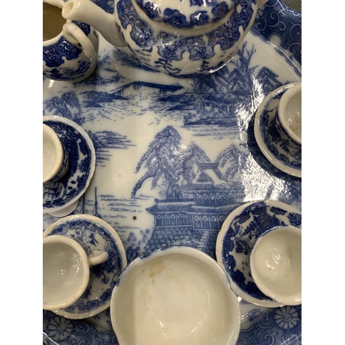 154 - A MINIATURE VICTORIAN BLUE AND WHITE TEASET ON A TRAY