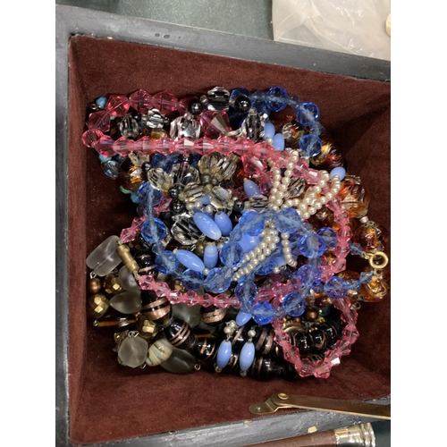 159 - A QUANTITY OF GLASS NECKLACES IN A VINTAGE DECORATIVE BOX