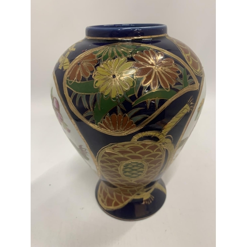 171 - AN ORIENTAL STYLE VASE IN COBALT BLUE WITH FLORAL PATTERN HEIGHT 21CM