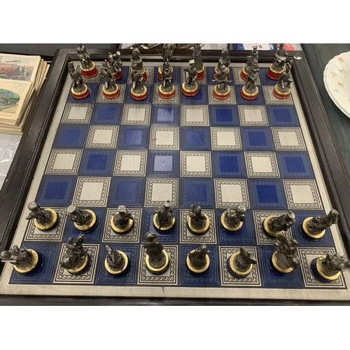 173 - A FRANKLIN MINT BATTLE OF WATERLOO CHESS SET WITH PIECE DESCRIPTION CARDS AND PEWTER AND BRASS PIECE... 