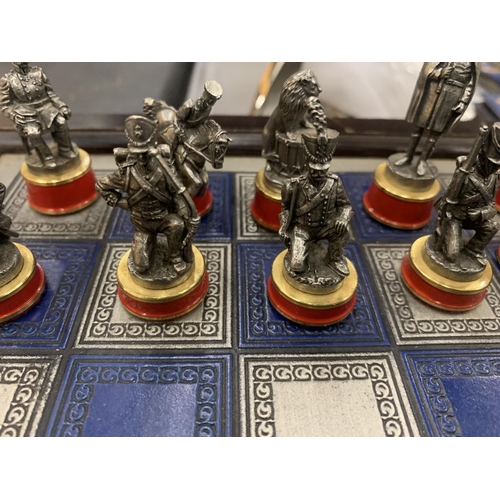 173 - A FRANKLIN MINT BATTLE OF WATERLOO CHESS SET WITH PIECE DESCRIPTION CARDS AND PEWTER AND BRASS PIECE... 