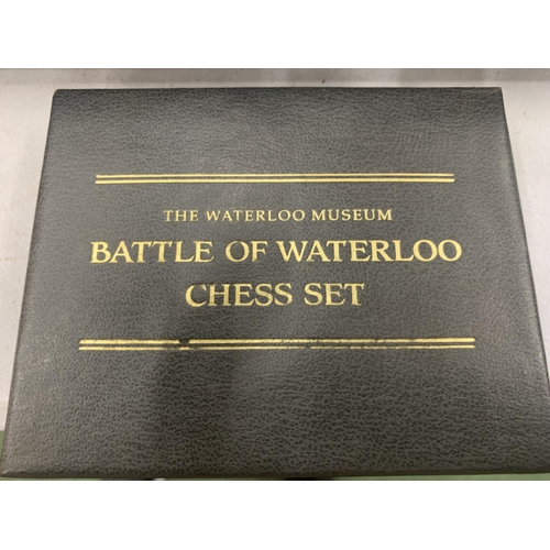 173 - A FRANKLIN MINT BATTLE OF WATERLOO CHESS SET WITH PIECE DESCRIPTION CARDS AND PEWTER AND BRASS PIECE... 