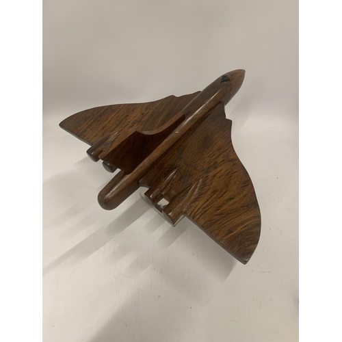 175 - A WOODEN MODEL OF A VULCAN BOMBER ON A CHROME BASE