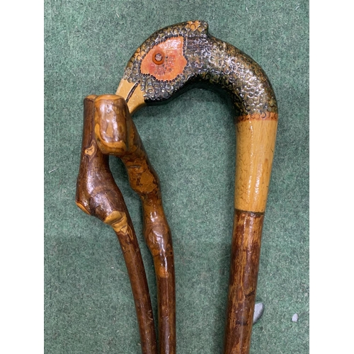 181 - THREE WALKING STICKS, ONE WITH A BIRDS HEAD HANDLE