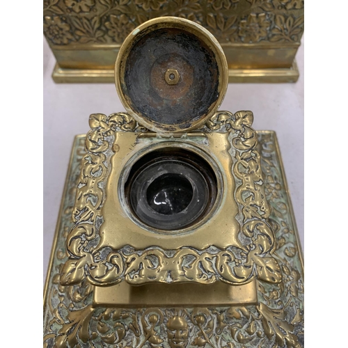 191 - AN ASIAN STYLE BRASS STATIONERY BOX WITH COMPARTMENTS AND INKWELL WITH GLASS LINER, BOTH WITH FLORAL... 