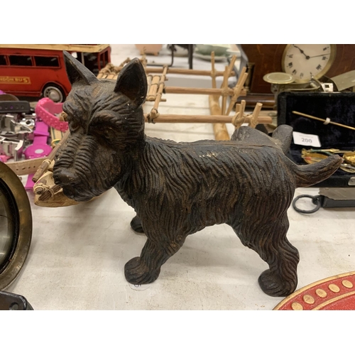 202 - A CAST MMODEL OF A SCOTTIE DOG COCKING ITS LEG HEIGHT 17CM, LENGTH 20CM