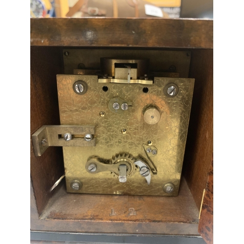 216 - A PRE 1936 BURR WALNUT MANTLE CLOCK WITH KEY - MARKED SEARLE & CO, LOMBARD STREET, LONDON