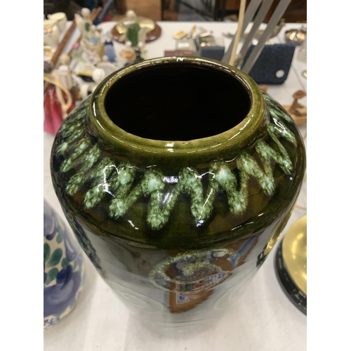 221 - A LARGE DARK GREEN WEST GERMAN VASE WITH SWIRL DECORATION HEIGHT 38CM