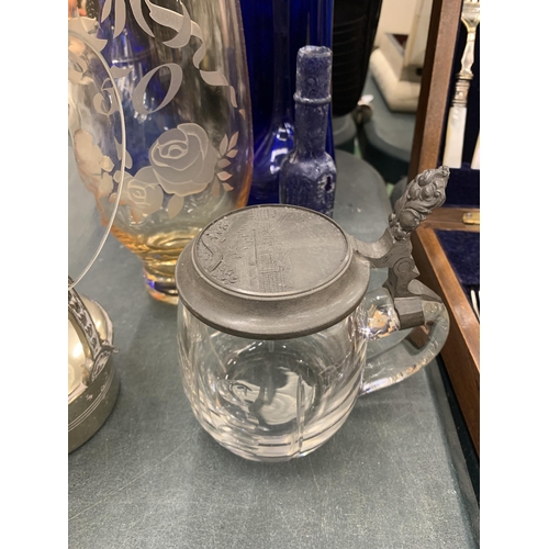 235 - A QUANTITY OF GLASSWARE TO INCLUDE A BRANDY GLASS WARMER WITH GLASS, BLUE BOTTLES, A ROYAL DOULTON '... 