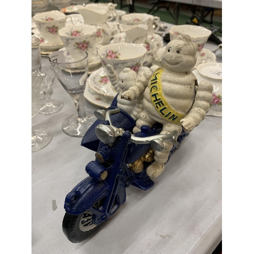 276 - A CAST MICHELIN MAN ON A MOTOR BIKE WITH A SIDE CAR