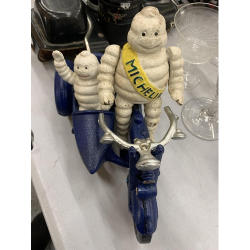 276 - A CAST MICHELIN MAN ON A MOTOR BIKE WITH A SIDE CAR