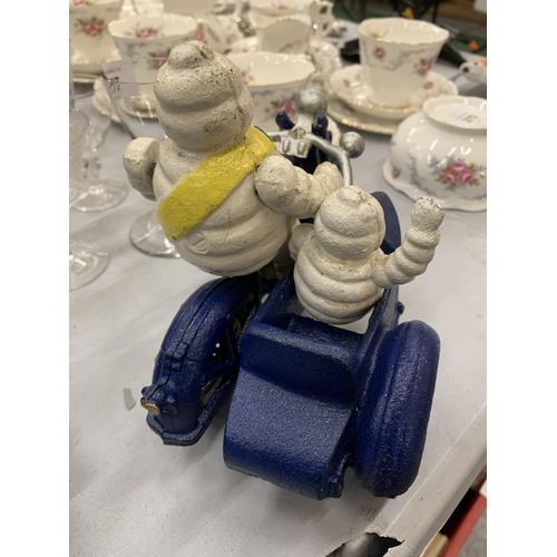 276 - A CAST MICHELIN MAN ON A MOTOR BIKE WITH A SIDE CAR