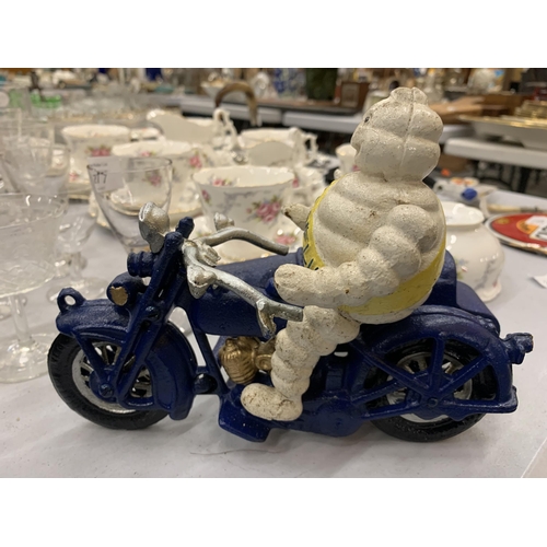 276 - A CAST MICHELIN MAN ON A MOTOR BIKE WITH A SIDE CAR