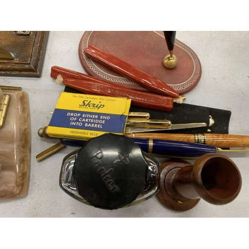 284 - AN ASSORTMENT OF DESK ITEMS TO INCLUDE A PEN HOLDER WITH CALANDER, A LETTER RACK, ETC