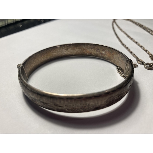 503 - TWO MARKED SILVER ITEMS TO INCLUDE A BANGLE WITH SAFETY CHAIN AND A NECKLACE WITH ST CHRISTOPHER PEN... 