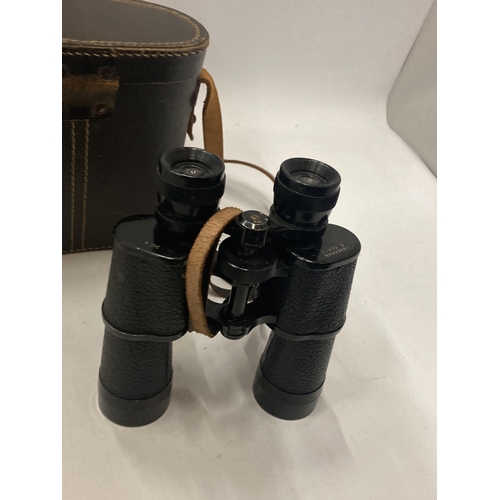 853 - A VINTAGE PAIR OF LIEBERMAN CORTZ BINOCULARS IN A LEATHER CASE