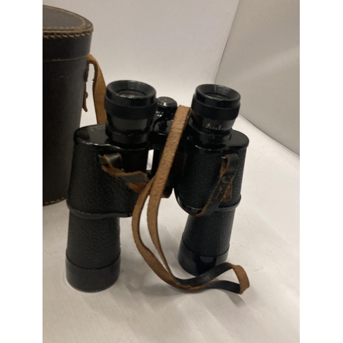 853 - A VINTAGE PAIR OF LIEBERMAN CORTZ BINOCULARS IN A LEATHER CASE