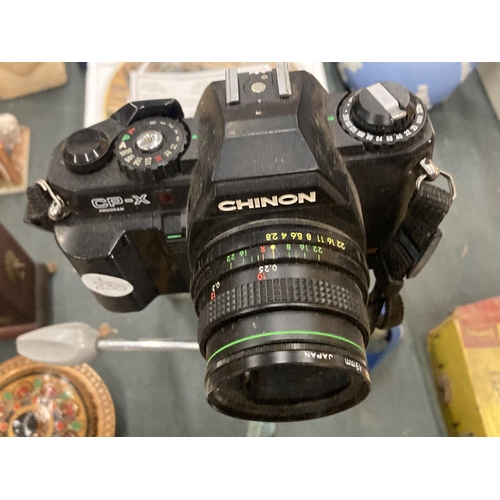 859 - TWO VINTAGE CAMERAS TO INCLUDE A SIX-20 BROWNIE, CHINON CP-X, A SIGMA ZOOM LENS IN LEATHER CASE AND ... 