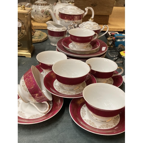 887 - A VINTAGE JAPANESE TEASET TO INCLUDE A TEAPOT, CREAM JUG, LIDDED SUGAR BASIN, CUPS, SAUCERS AND SIDE... 